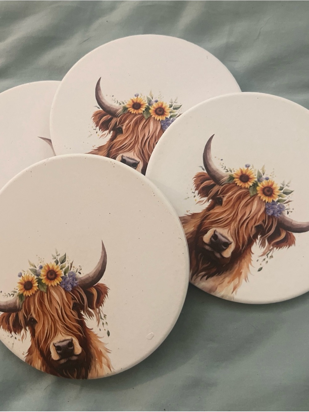 Set of 4 Highland Cow Round Coasters - White with Floral Crown Print